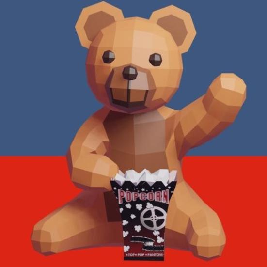 Billede af Bamse, der spiser popcorn og vinker.